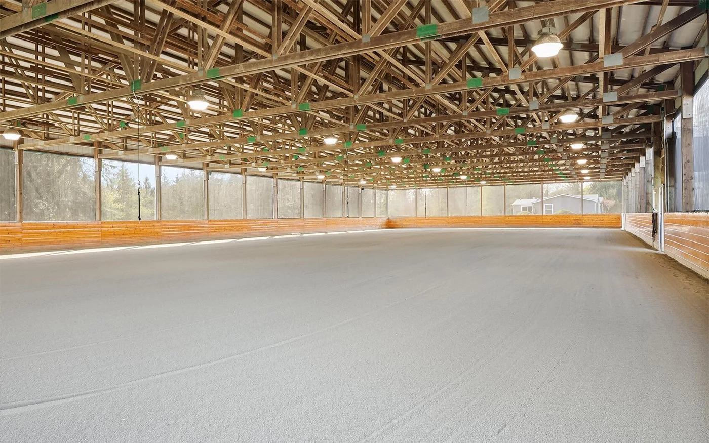 Wide view of the covered dressage arena at Seven Hills Training in Monroe, Washington